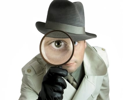 Detective with magnifying glass