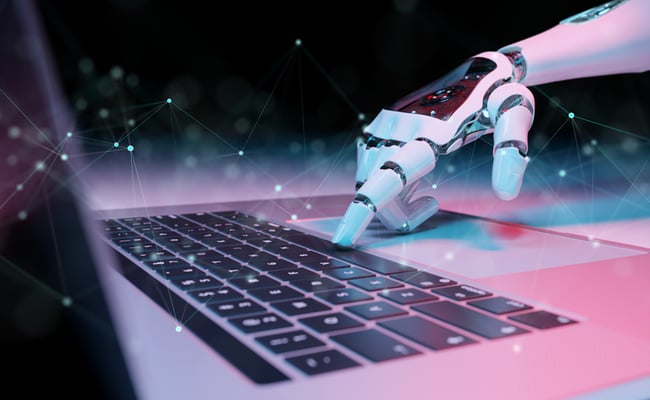 AI in b2b marketing - robotic arm typing on keyboard