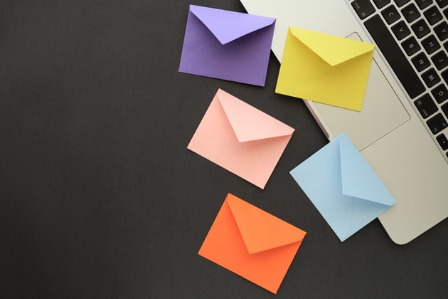 Follow-Up Email Marketing - envelopes on computer desk