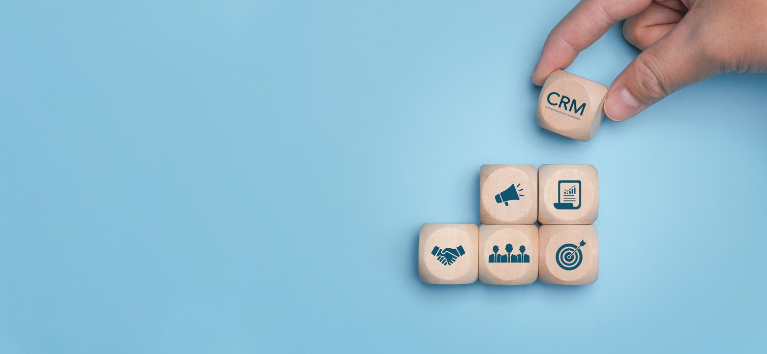 Brown stacking blocks with marketing and business icons