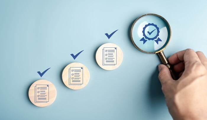 seo tasks - magnifying glass examining checklists